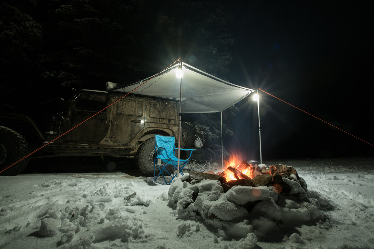 Camp fire by the Jeep